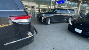 Luxury Black Cars are standing outside airport for Airport Pickup