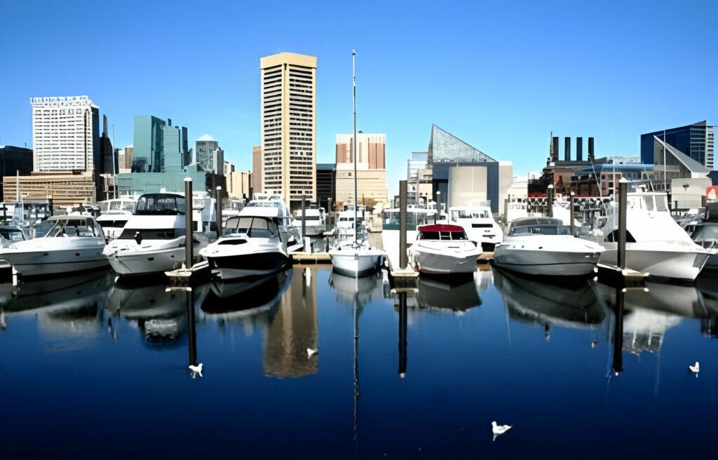 Boats and buildings lining the downtown harbor in the city of Baltimore on a crisp winter day