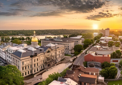 Aerial panorama of Trenton New Jersey skyline amd state capitol at sunset