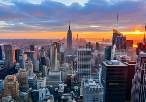 NEW YORK, UNITED STATES - DECEMBER 28, 2015 - New York City skyline with urban skyscrapers at sunset.